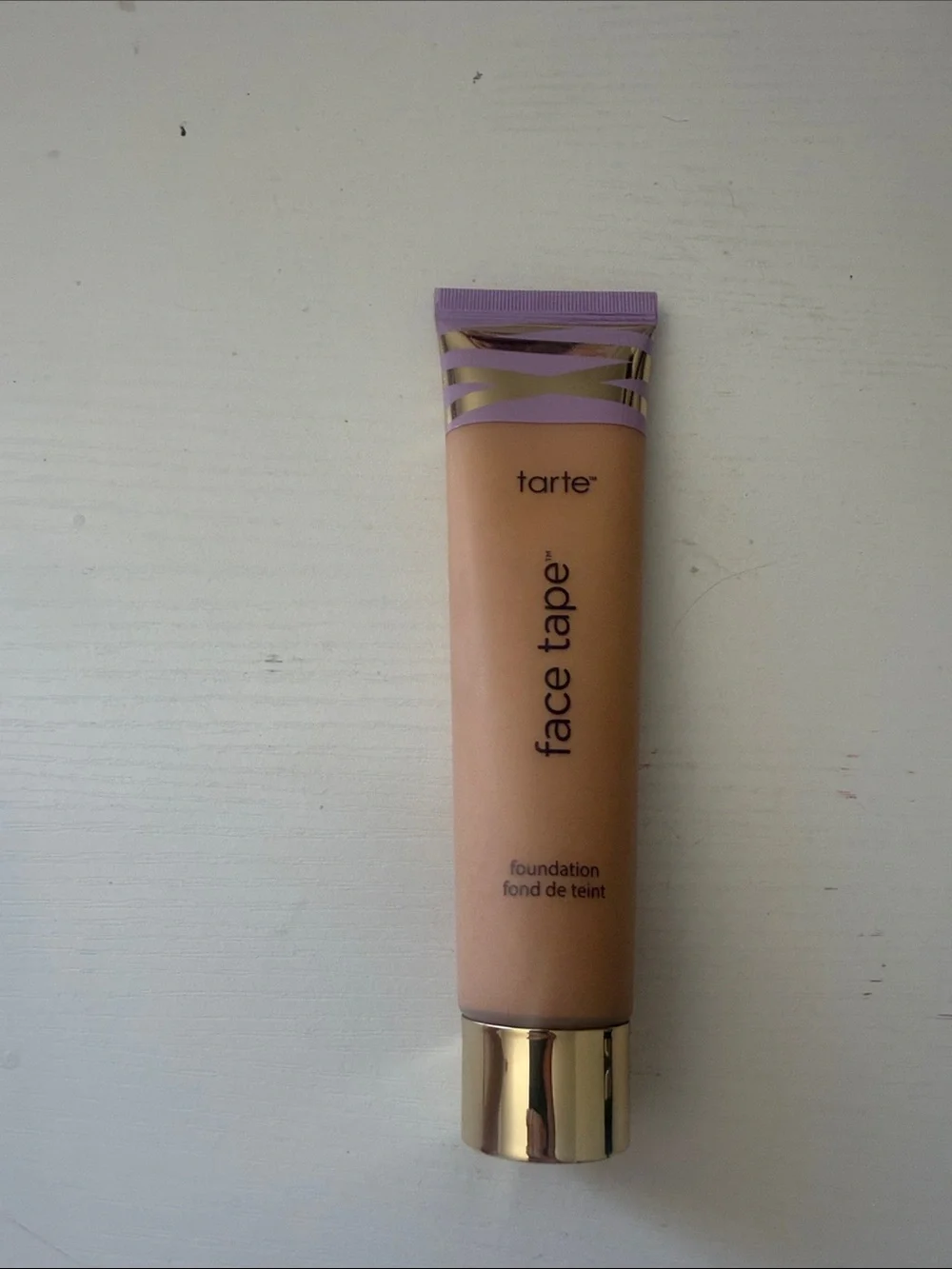 tarte Face Tape Foundation - beige with purple cap and gold accents